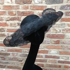 a halo of black distressed crin adorns this exquisite hat by gabriela ligenza.
