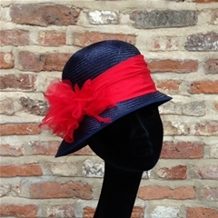 Navy blue straw cloche, red dupion silk trim and rose detail. Versatile hat, can be made in any colours for horse show dudges and show pony leaders.