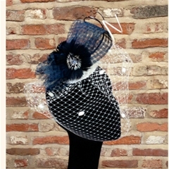 vivien sheriff navy basket weave loop with curled spadonas and veiling. fastens on a comb.
