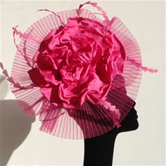 dramatic circle of pleated crinoline with fuschia flower and feather detail. set on a wide padded headband. available in other colours too.