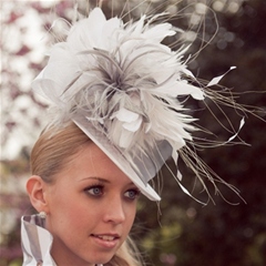 White top hat base layered with silk sash and flower detail.