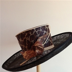 by philip somerville. black hat with leopard print detail.