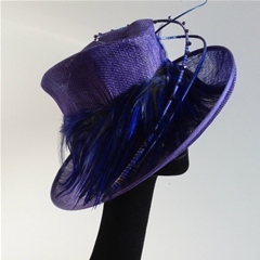 by vivien sheriff millinery. in a glorious shade of purple with beadwork and feather trim.