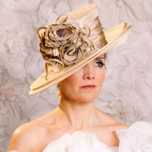 beautiful double brim ivory hat with rose detail.