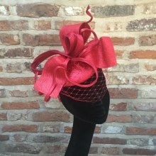 red straw pillbox with veiling