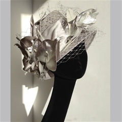 neat nigel rayment in silver with metallic leaves and veiling.