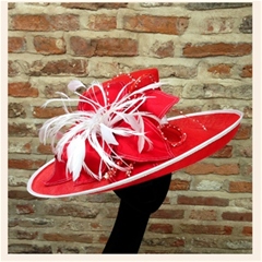 intricately beaded red and white hat with dupion silk petals.