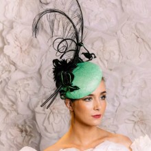 vibrant green beret with beaded & embroidered silk velvet leaves, curled ostrich feathers.
