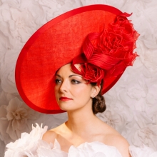 red saucer with organza roses by guibert millinery